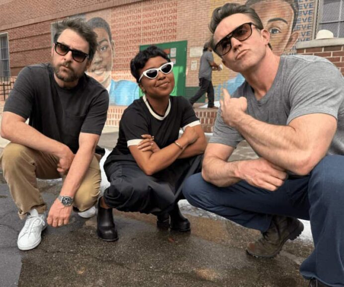 abc fall Rob McElhenney, Charlie Day, and Quinta Brunson posing on the "Abbott Elementary" set.