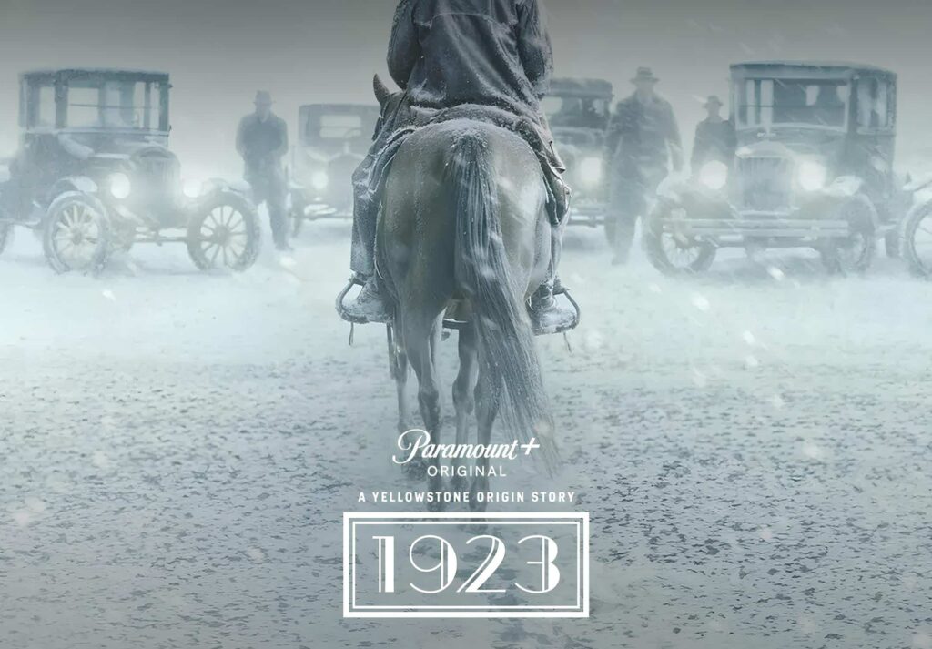 1923 promotional image in black and white with older cars and a horse