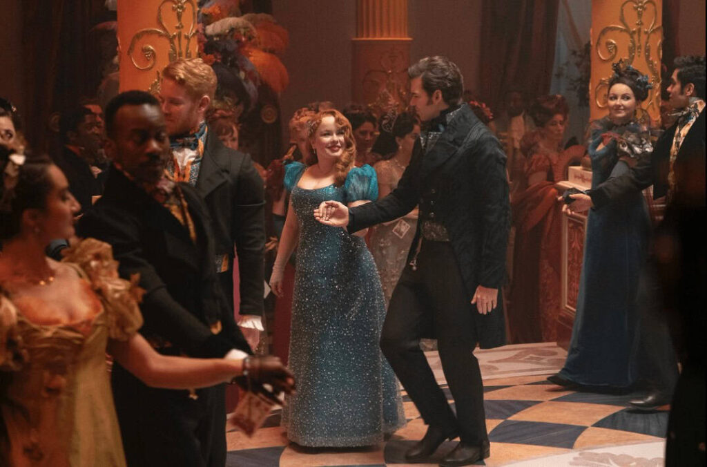 Elegant ballroom dance scene from the Netflix series Bridgerton featuring characters in period costumes.