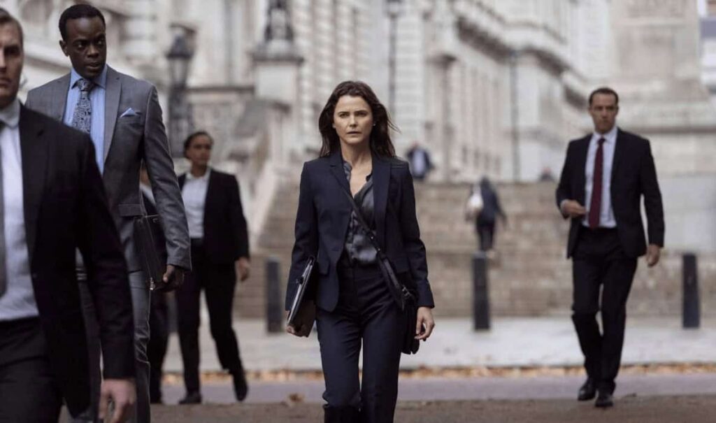 Keri Russell as Kate Wyler in a thoughtful pose from The Diplomat, a political Netflix show.