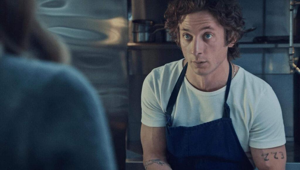 Jeremy Allen White as Carmy in a tense kitchen scene from The Bear, an acclaimed dramedy show.