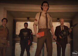 screenshotted image from the Marvel tv series Loki, with Tom Hiddleston front and center as Loki inside the TVA