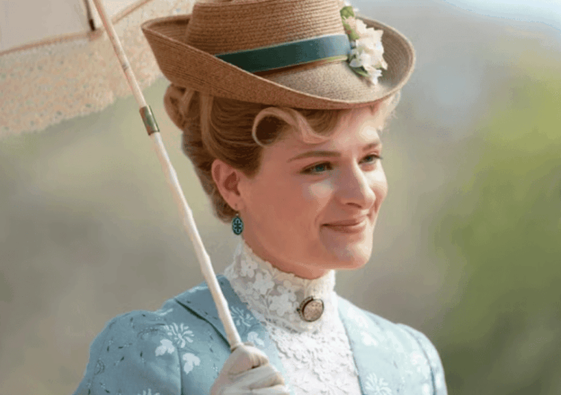 close-up of Marian, smiling, with a garden in the background