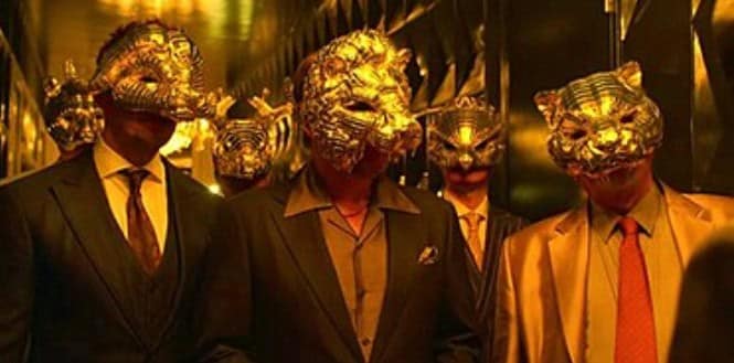 The VIPs from Squid Game wearing golden masks resemble Elon Musk.