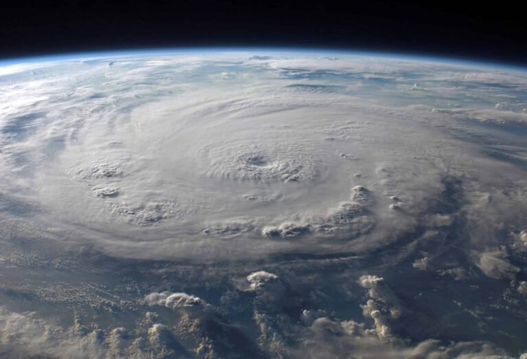 A stunning aerial view of Earth with a massive swirling hurricane, highlighting meteorological beauty. Hurricane-proofing