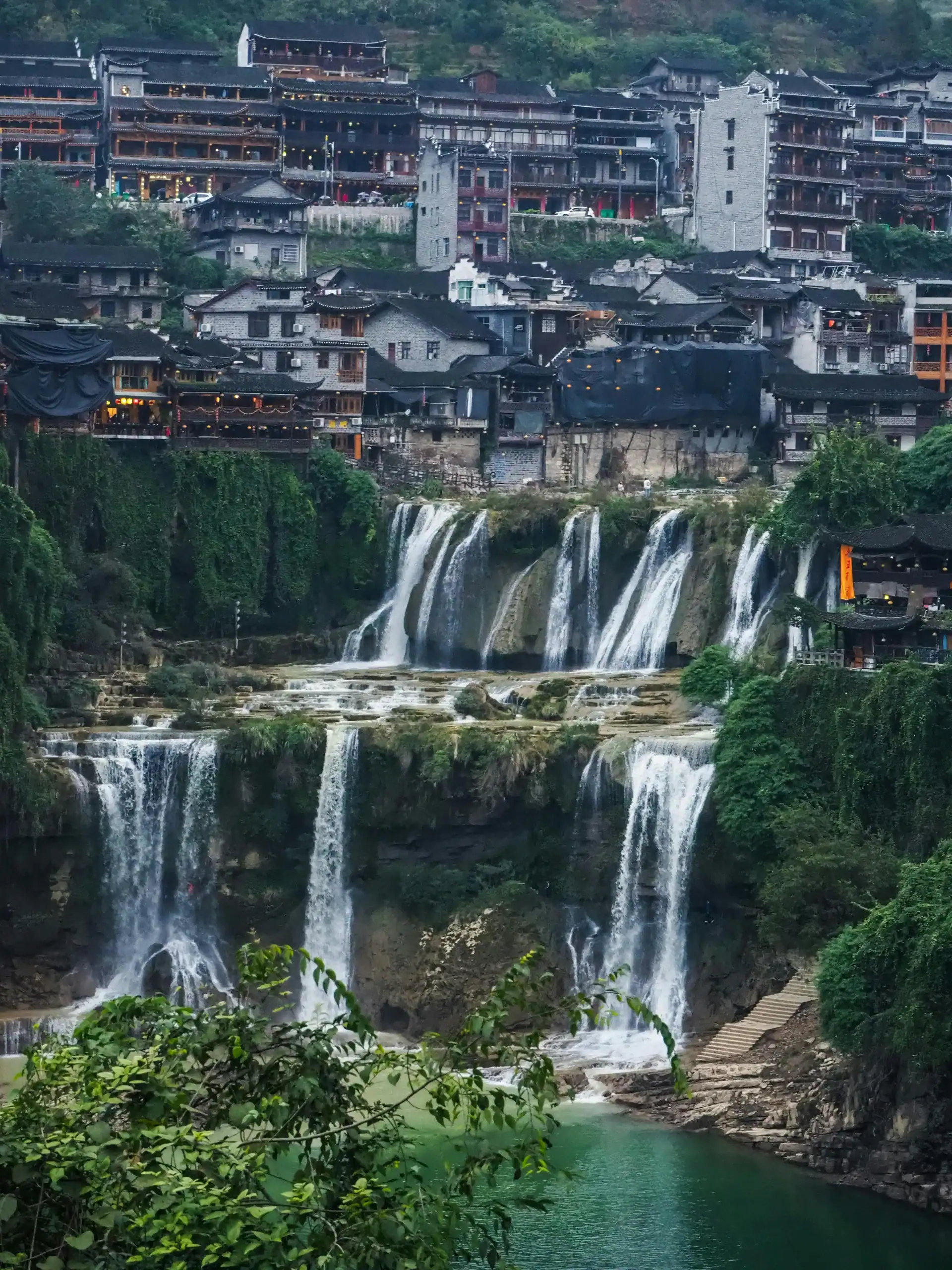 Furong village resting atop the waterfalls in China