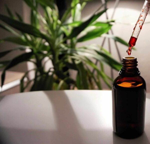 Vitamin B12 nutritional supplement in a laboratory vessel with a pipette, highlighting B12 research and supplementation. Photo by MarcOliver_Artworks via Pixabay.