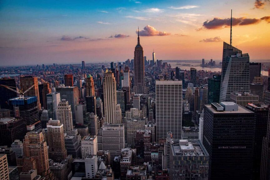 This is a photograph of New York City buildings. New York City can be included in a discussion of travel spots for families.