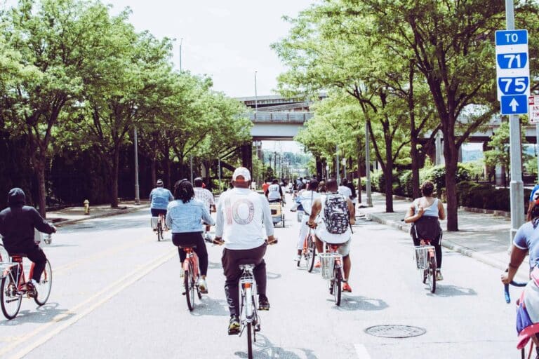 Cyclists enjoying a group ride on a sunny day in downtown Cincinnati. commuter bikes