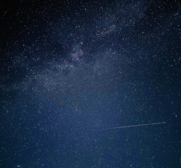 Star-filled night sky with a meteor streaking overhead—capturing the celestial motion that Sidereal Time helps track. Image by Em Hopper via Pexels.