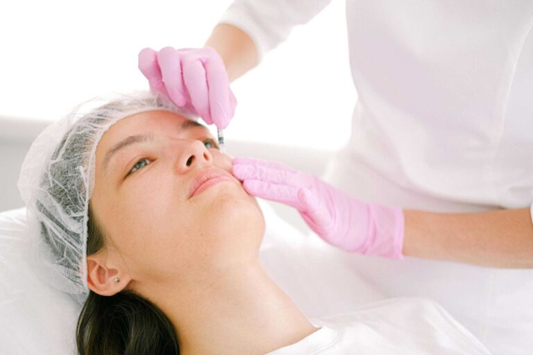 Woman receives cosmetic injection in clinical setting, enhancing beauty using modern techniques. microdosing filler