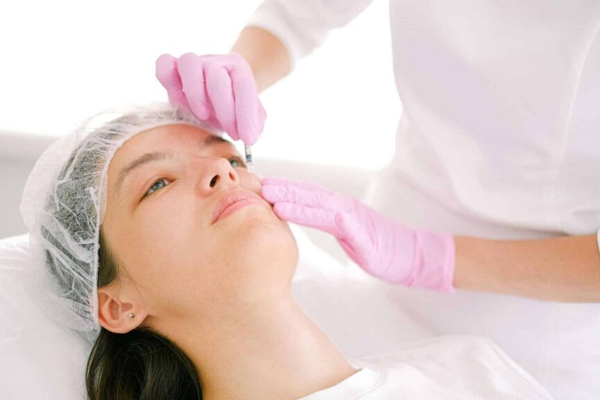 Woman receives cosmetic injection in clinical setting, enhancing beauty using modern techniques. microdosing filler