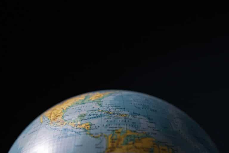 Focused image of a globe highlighting Cuba and Central America with a dark background. Daily devotion