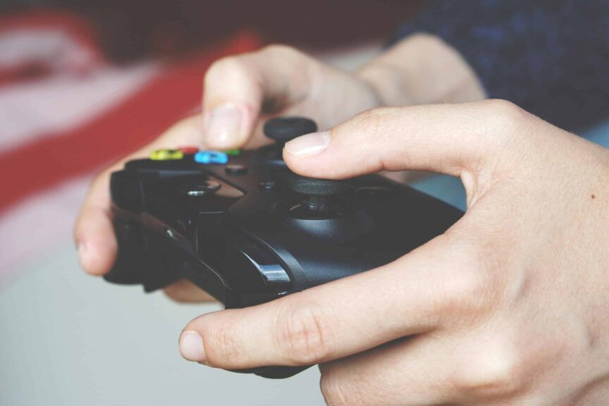 Hands holding an Xbox controller for the October subscription games roundup