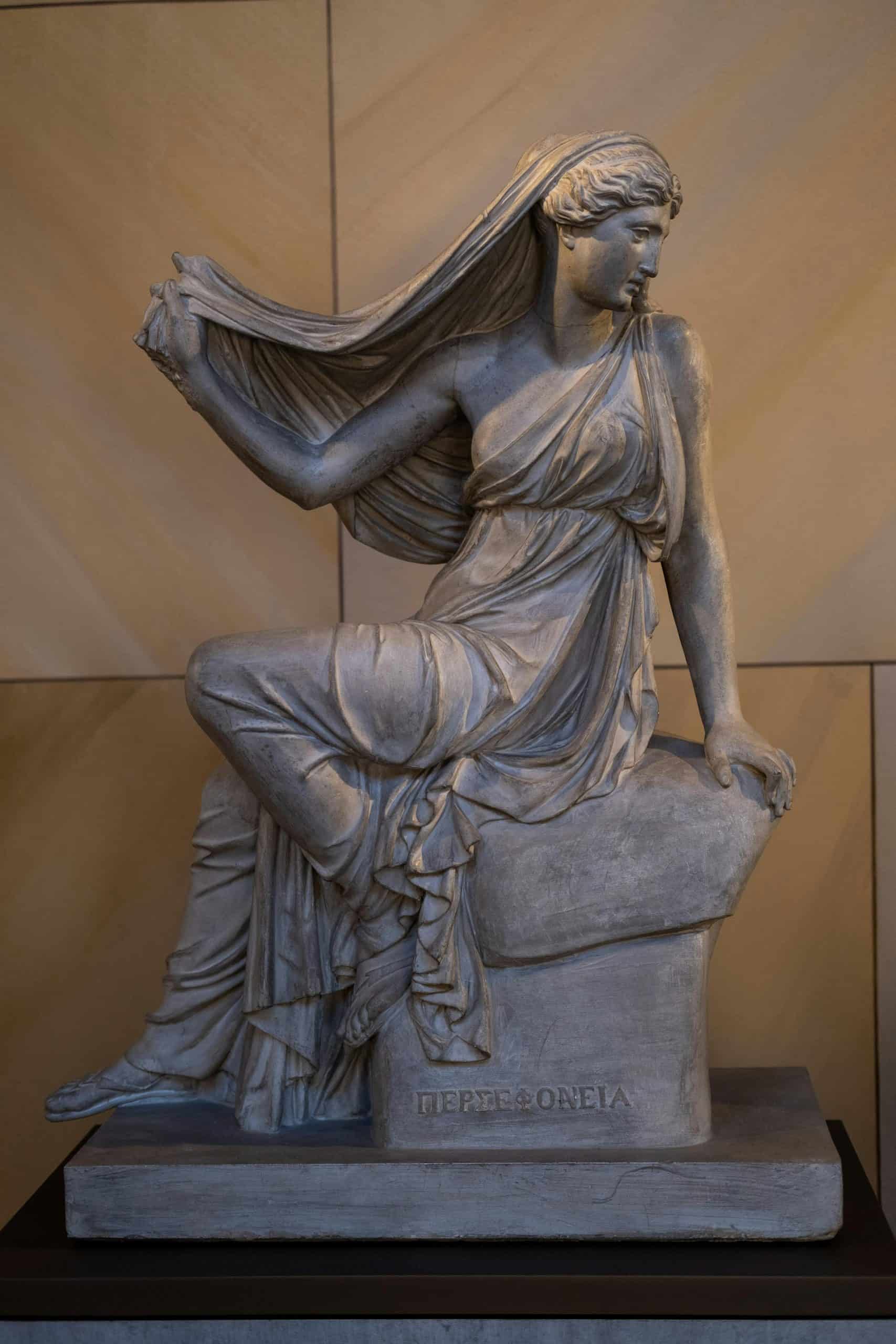 Elegant Greek statue of Persephone on display in a Berlin museum capturing ancient artistry.