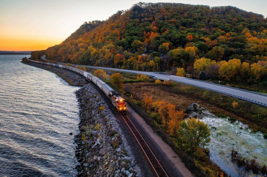 fall colors, A scenic autumn train ride along a lake in Reads Landing, Minnesota, surrounded by vibrant fall foliage.