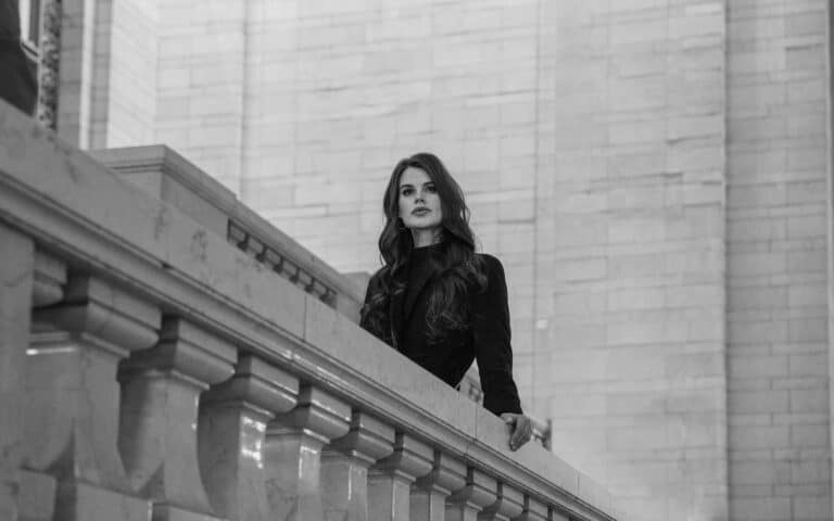 This photograph features a woman standing in a New York setting. NYFW (New York Fashion Week) for September 2025 has engaging design presentations.