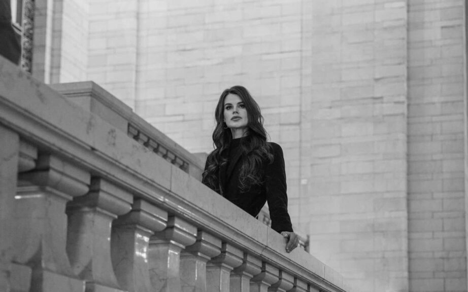 This photograph features a woman standing in a New York setting. NYFW (New York Fashion Week) for September 2025 has engaging design presentations.
