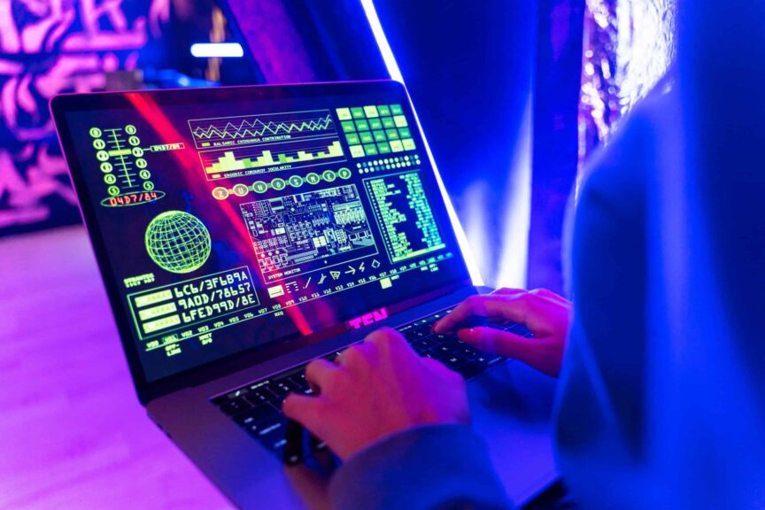 Person typing on a laptop with vibrant digital data display, highlighting cyber security. nano11