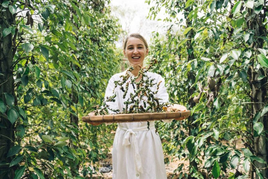 A joyful woman harvesting fresh peppercorns on a sunny day on the farm biblical teachings