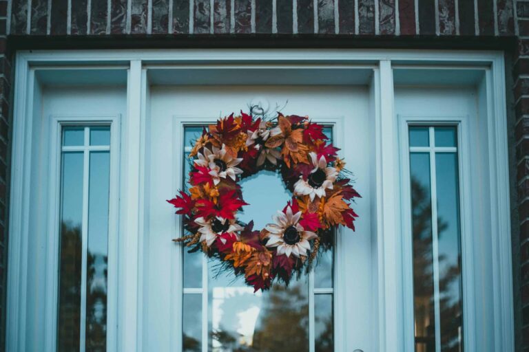 Colorful autumn wreath on a front door, capturing fall's festive charm. fall wreath
