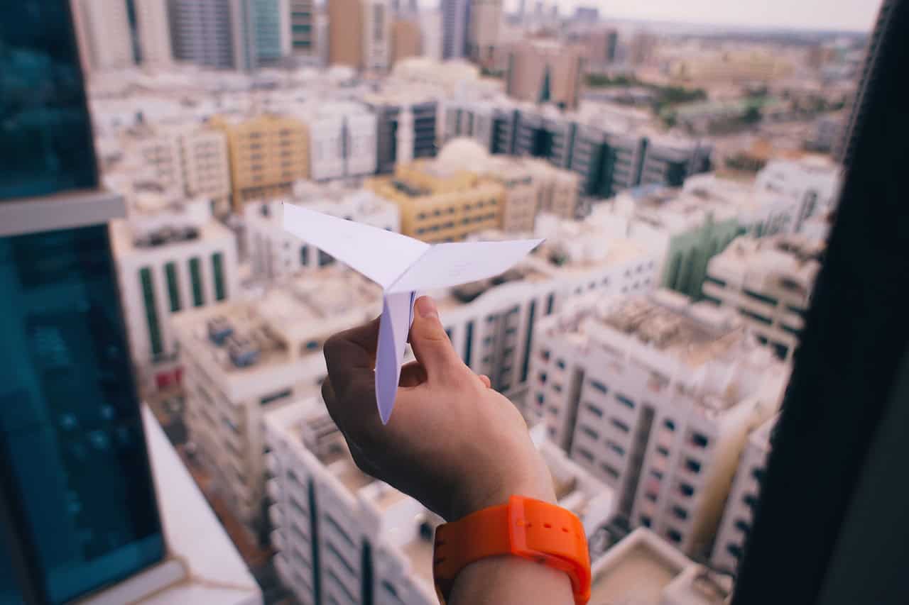paper, airplane, hand, building, watch, window, architecture, infrastructure, city, towers, urban, art