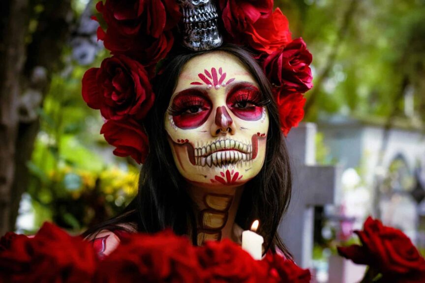 Colorful Catrina makeup portrait in a Mexican cemetery for Day of the Dead celebration, Mexico City