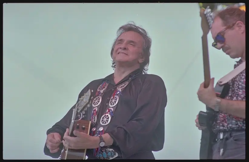 Today's epic earworm is from Johnny Cash, pictured here performing at Fan Fair held at the State Fairgrounds in Nashville, Tennessee in 1993.