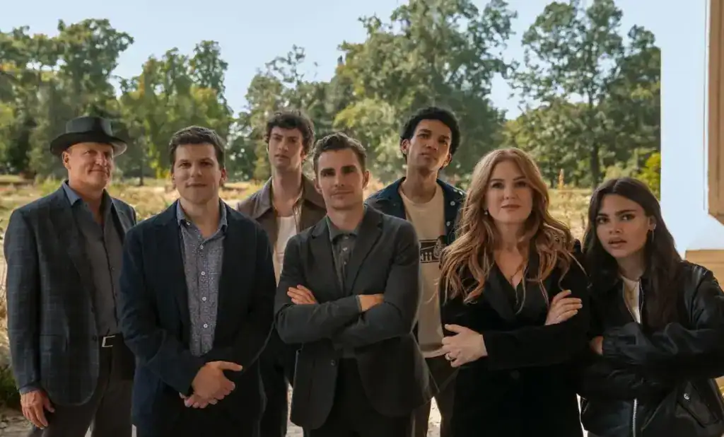 The Cast of Now You See Me: Now You Don't, looking at an unknown object.