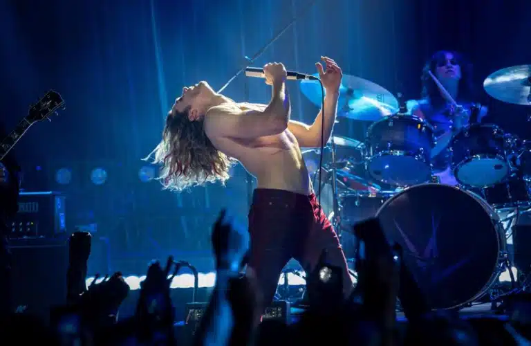 Rocker Vampire Lestat on stage performing.