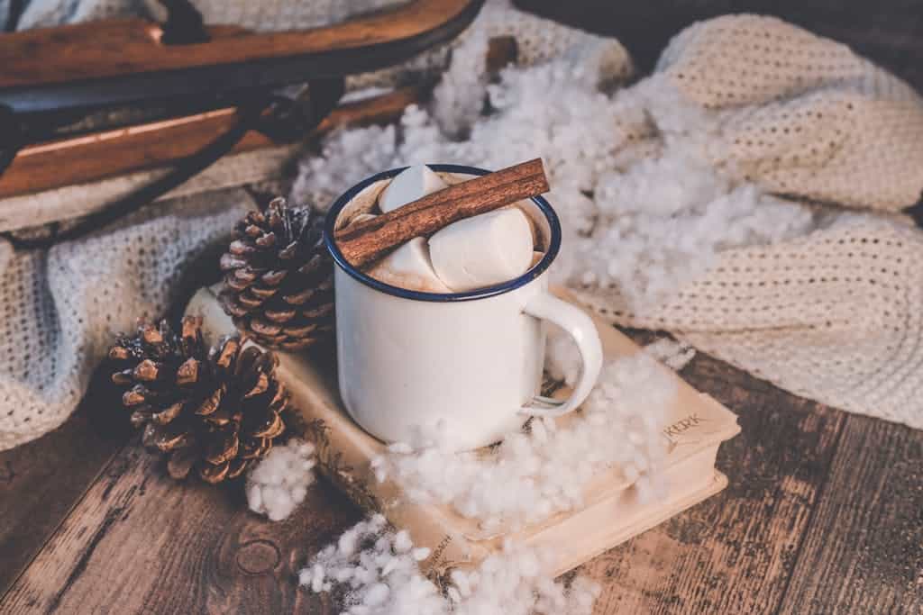 A cozy, warm cocktail with hot chocolate, cinnamon, and marshmallows.