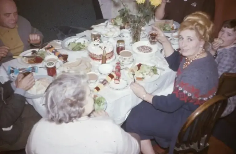 A family eating Christmas dinner, 1965. 35mm film slide image, family tension