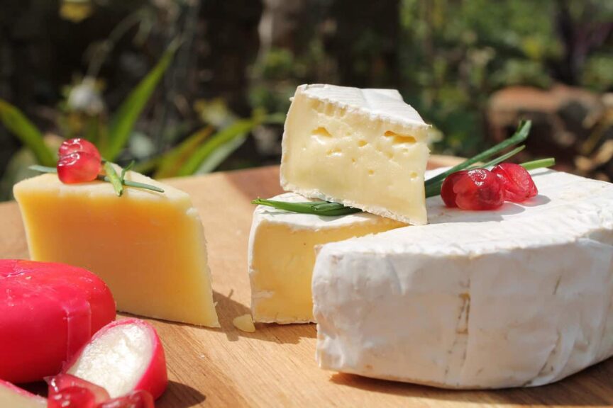 This is a photograph of a cheese display. A cheese board can be a convenient and enticing option for fall guests.