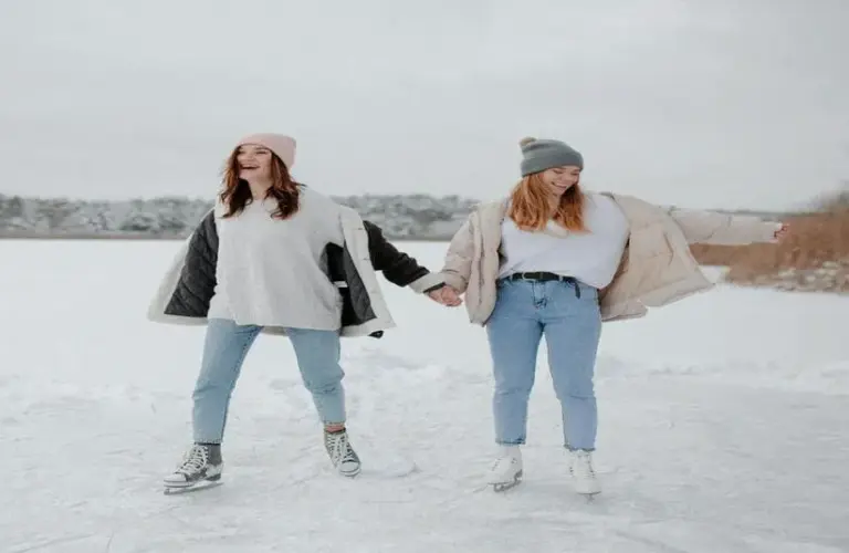 Friends going ice skating for winter activities that strengthen friendships.