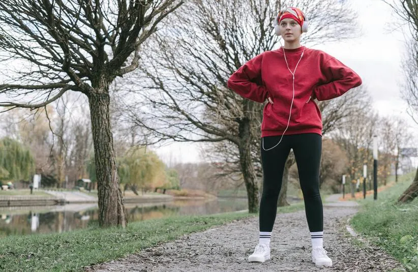 Person out on a walk in the cold weather. Walking is a good winter workout option.
