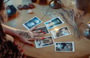Assorted Tarot cards on a table that could be used to help determine your birth card.