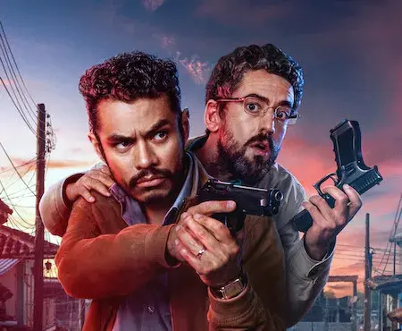 Two serious-looking men stand back to back, holding guns against a cityscape at sunset. The words "A Time for Bravery" are displayed in bold orange.