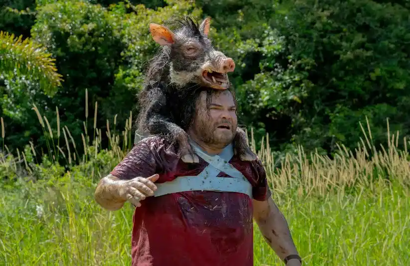 Jack Black in the movie "Anaconda" carrying Boris on his shoulders.