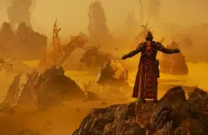Helldivers 2 player character in Oshaune Campaign Cape stands on rocky terrain with outstretched arms, facing a dramatic alien landscape bathed in golden light.