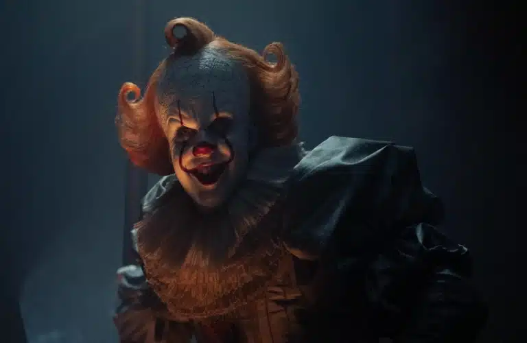 Pennywise from IT: Welcome to Derry, giving an evil smile.