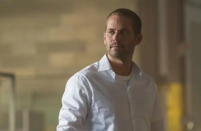 Paul Walker in Furious 7 (2015) in a white button-up shirt.