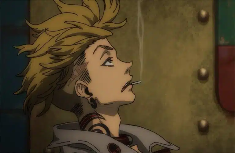 Katsuyuki Konishi in Gachiakuta (2025) on Crunchyroll with spiky blonde hair and tattoos smokes a cigarette, gazing upward in contemplation against a muted, industrial background.