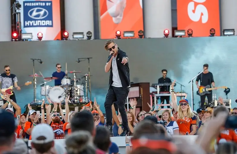 OneRepublic performs at the Kickoff Village at Civic Center Park.