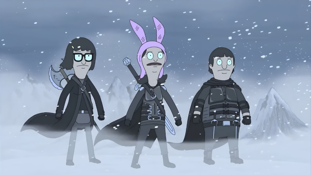 Three animated characters in Viking attire stand in a snowy, windswept landscape. One wears pink bunny ears. The mood is adventurous and determined.
