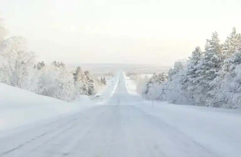 Ice roads in Lapland, road covered in snow, winter travel