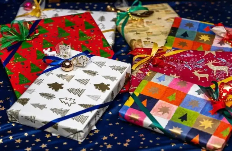 Pile of wrapped Christmas presents, holiday presents, mindful gift giving