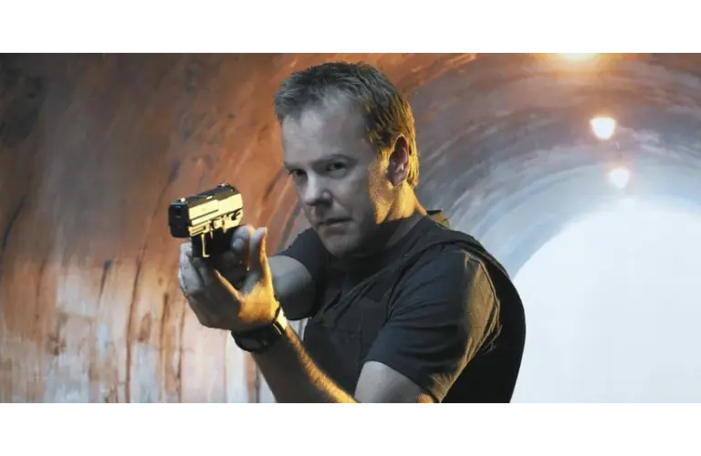 Kiefer Sutherland as Jack Bauer aiming a pistol, standing in a dimly lit tunnel