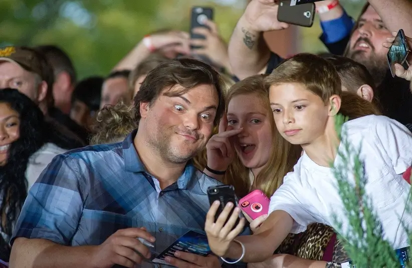 Actor Jack Black takes selfies with fans while walking the red carpet during an early screening of the Goosebumps movie benefiting Variety, The Children's Charity of Eastern Tennessee, at the Regal Pinnacle Stadium 18 movie theater in Knoxville 24, 2015.