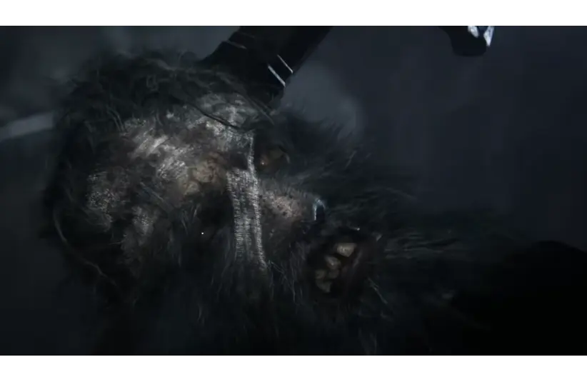 A zombie in Bloodborne, with matted fur and sharp teeth, appears against a dark, misty background. The atmosphere is eerie and intense, conveying a sense of fear.