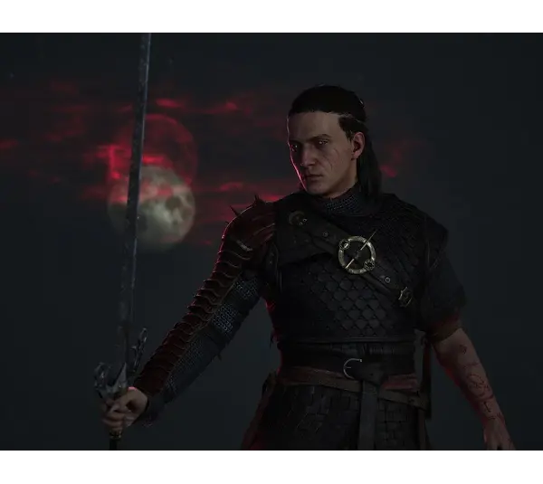 A warrior in dark armor holds a sword under a mysterious red moonlit sky. His intense expression and tattoos convey a sense of determination. Coen from The Blood of Dawnwalker, courtesy of Rebel Wolves and Bandai Namco Entertainment.